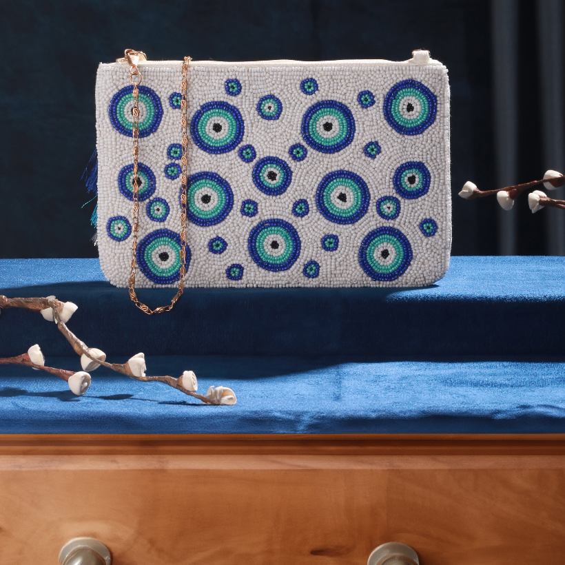 Beautiful blue and white beaded clutch with silky tussle