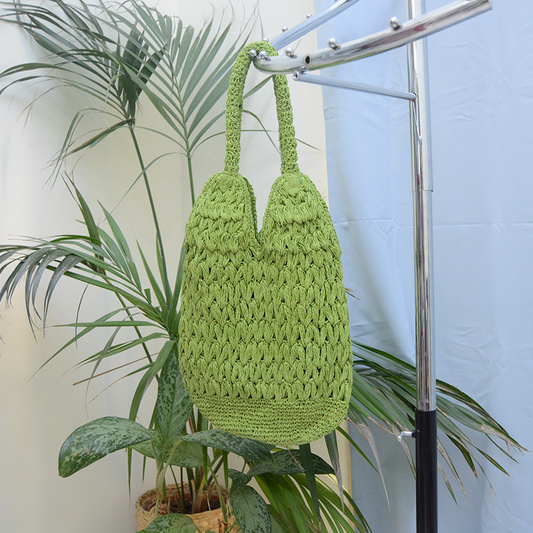 Handmade Raffia bag green color with magnetic button clasp.