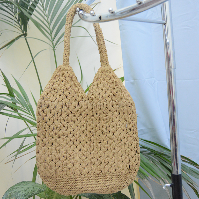 Handmade Raffia bag natural color with magnetic button clasp.