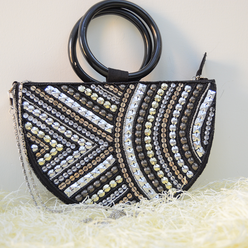 Half round black bag handmade by using beads and sequins.