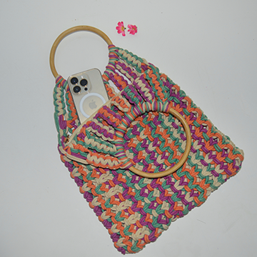 Multicolor handwoven macrame bag with wooden handle.