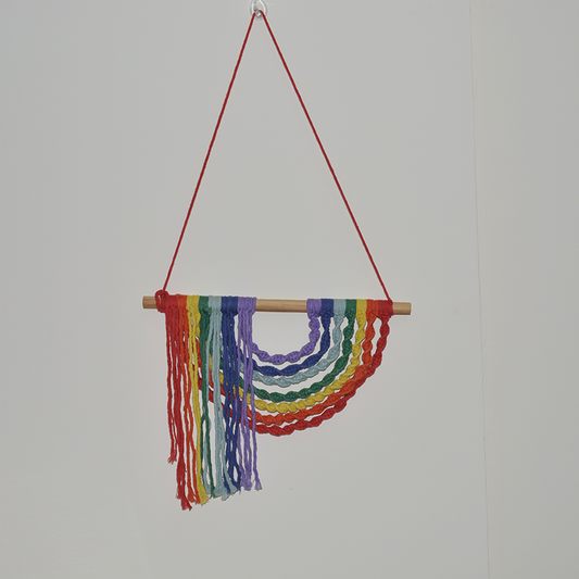 Bright and beautiful multi colored inverted rainbow wall hanging handmade by using cotton macrame cords.